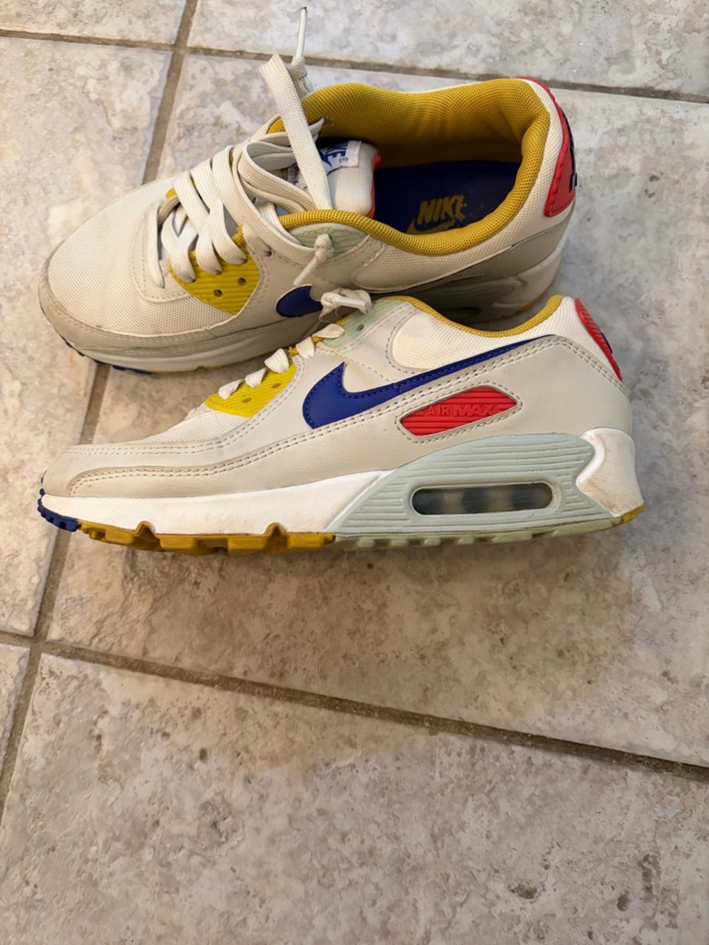 Nike  White Sneakers with Blue, Yellow and Red Accents